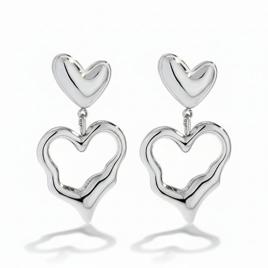 White gold-plated stainless steel drop earrings with solid and open heart charms – naušnice