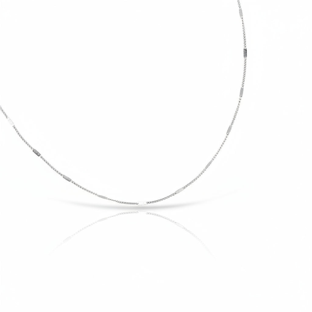 Silver chain necklace on a white background