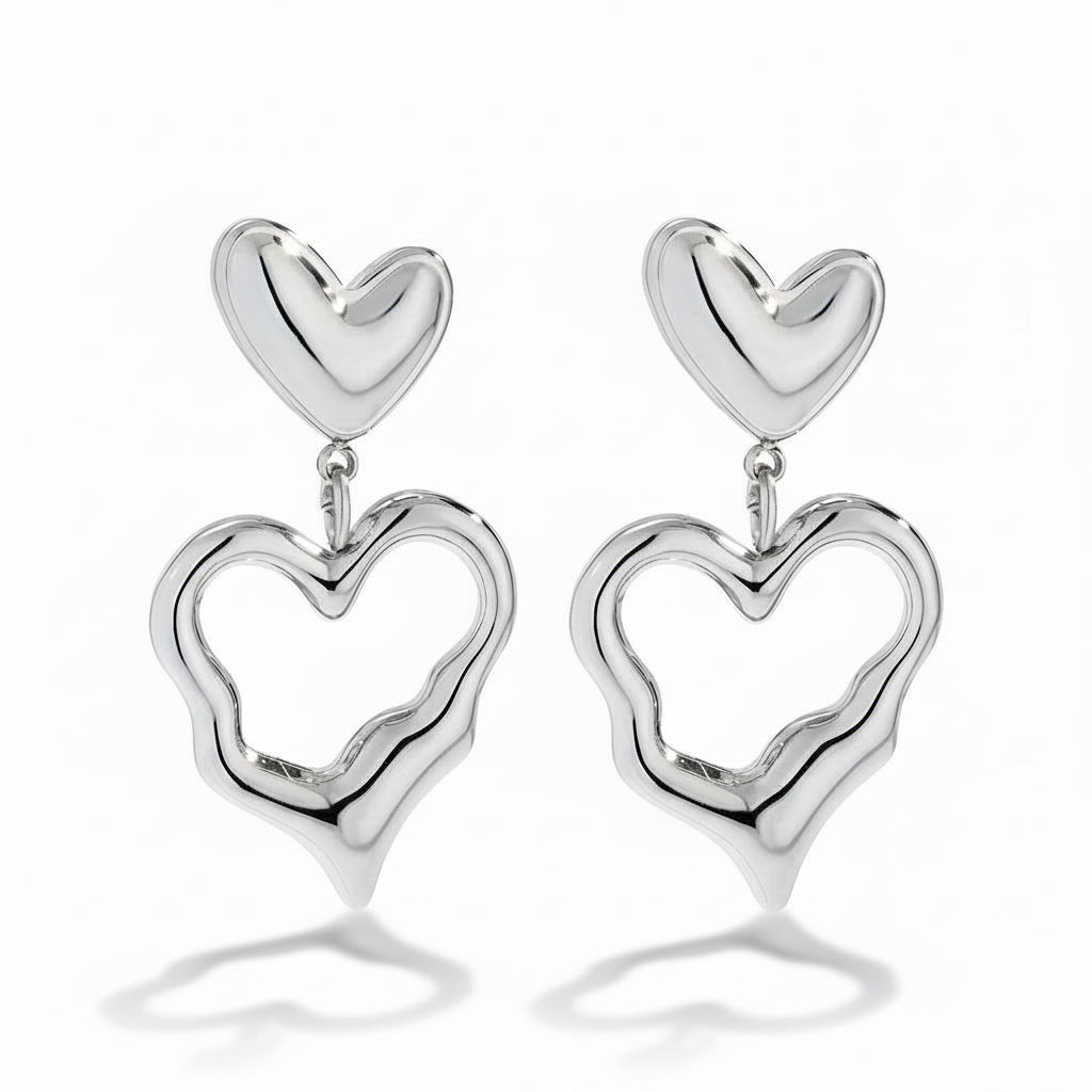 White gold-plated stainless steel drop earrings with solid and open heart charms – naušnice