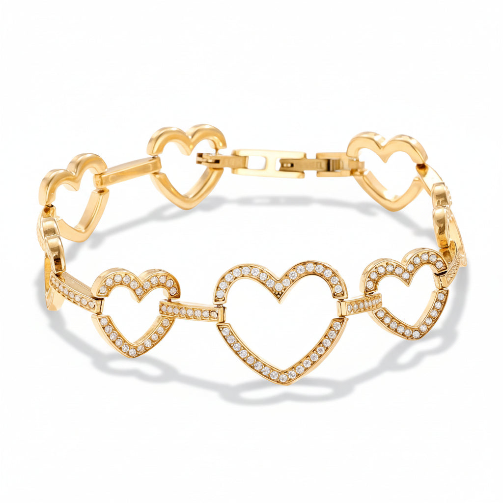 Gold linked hearts bracelet worn on wrist showing cubic zirconia-lined heart connections