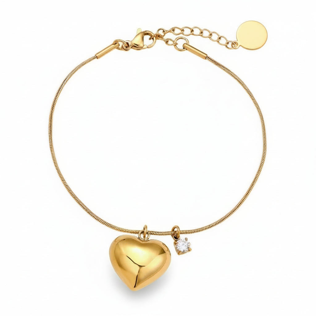Gold puffed heart charm bracelet with crystal accent on delicate snake chain