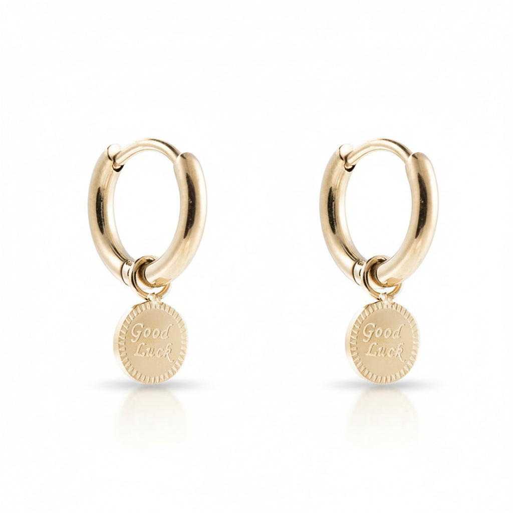 Gold-plated stainless steel huggie hoop earrings with an engraved Good Luck disc charm – naušnice