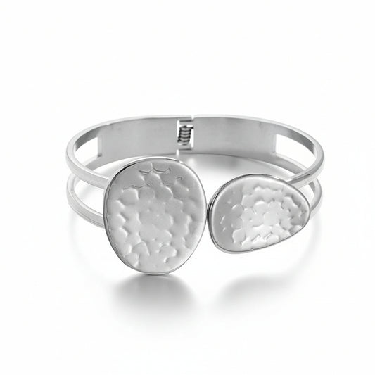 White gold-plated hammered bangle with two textured disc details on double-band frame



