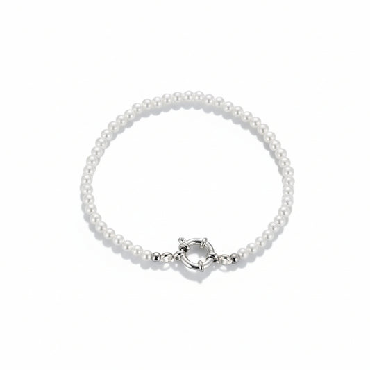 Luminous pearl bracelet with stainless steel clasp on white background
