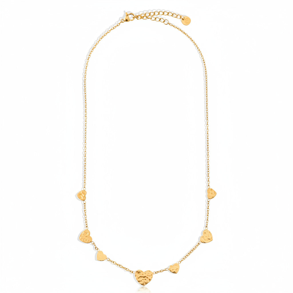 Gold-plated stainless steel delicate chain necklace with scattered mini heart charms – ogrlica