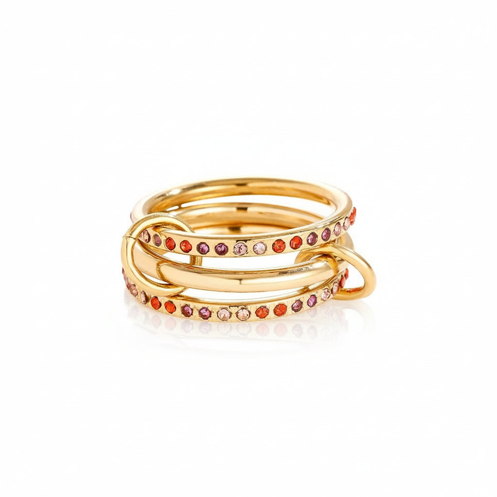 gold triple-band linked ring with pink and orange gradient zircon stones