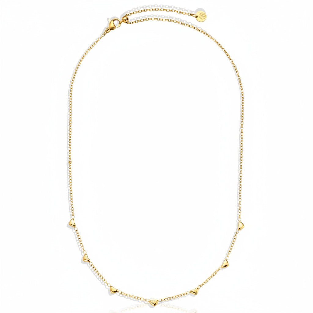 Gold-plated stainless steel fine chain necklace with scattered heart charms in asymmetric design – ogrlica