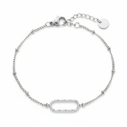 Silver oval link bracelet with textured centerpiece on delicate satellite chain