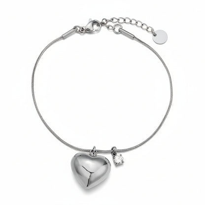 Silver puffed heart charm bracelet with crystal accent on delicate snake chain