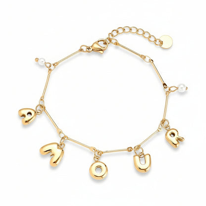 Gold AMOUR letter charm bracelet with freshwater pearl accents on delicate chain