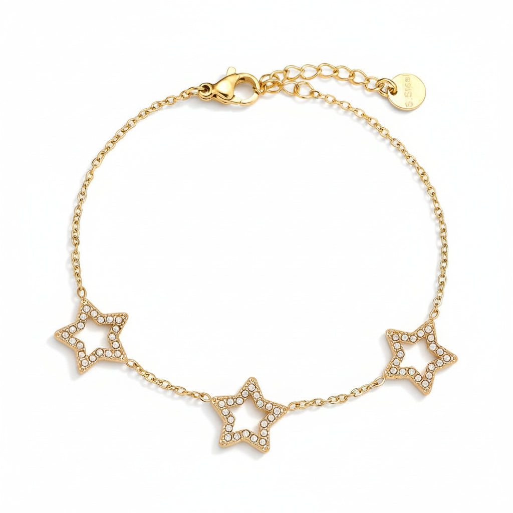 Gold bracelet with three star charms on white background – narukvica