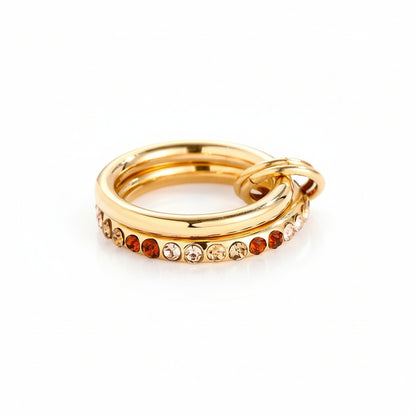 Sunset Gradient Link Ring with two linked gold bands and warm amber-gradient zircon stones.