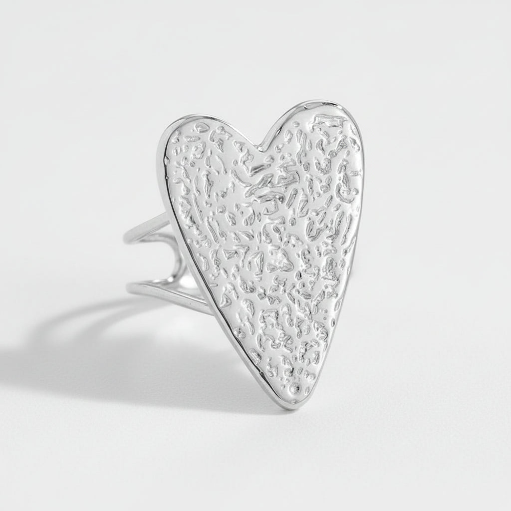 Silver heart-shaped ring with textured design