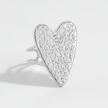 Silver heart-shaped ring with textured design