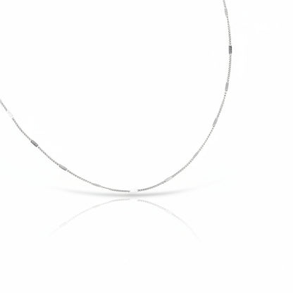 Silver chain necklace on a white background