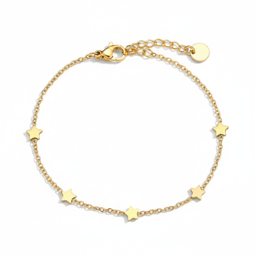 Gold scattered star bracelet with five celestial charms on delicate chain