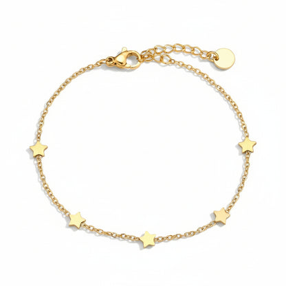 Gold scattered star bracelet with five celestial charms on delicate chain